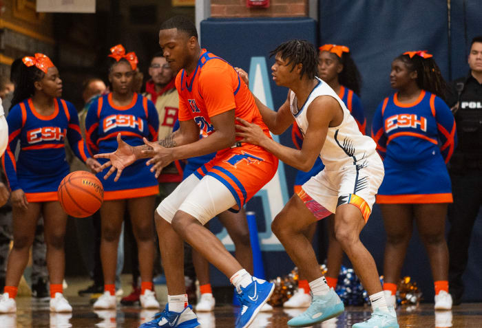 Belleville East's Jackson Muse defends against East St. Louis.